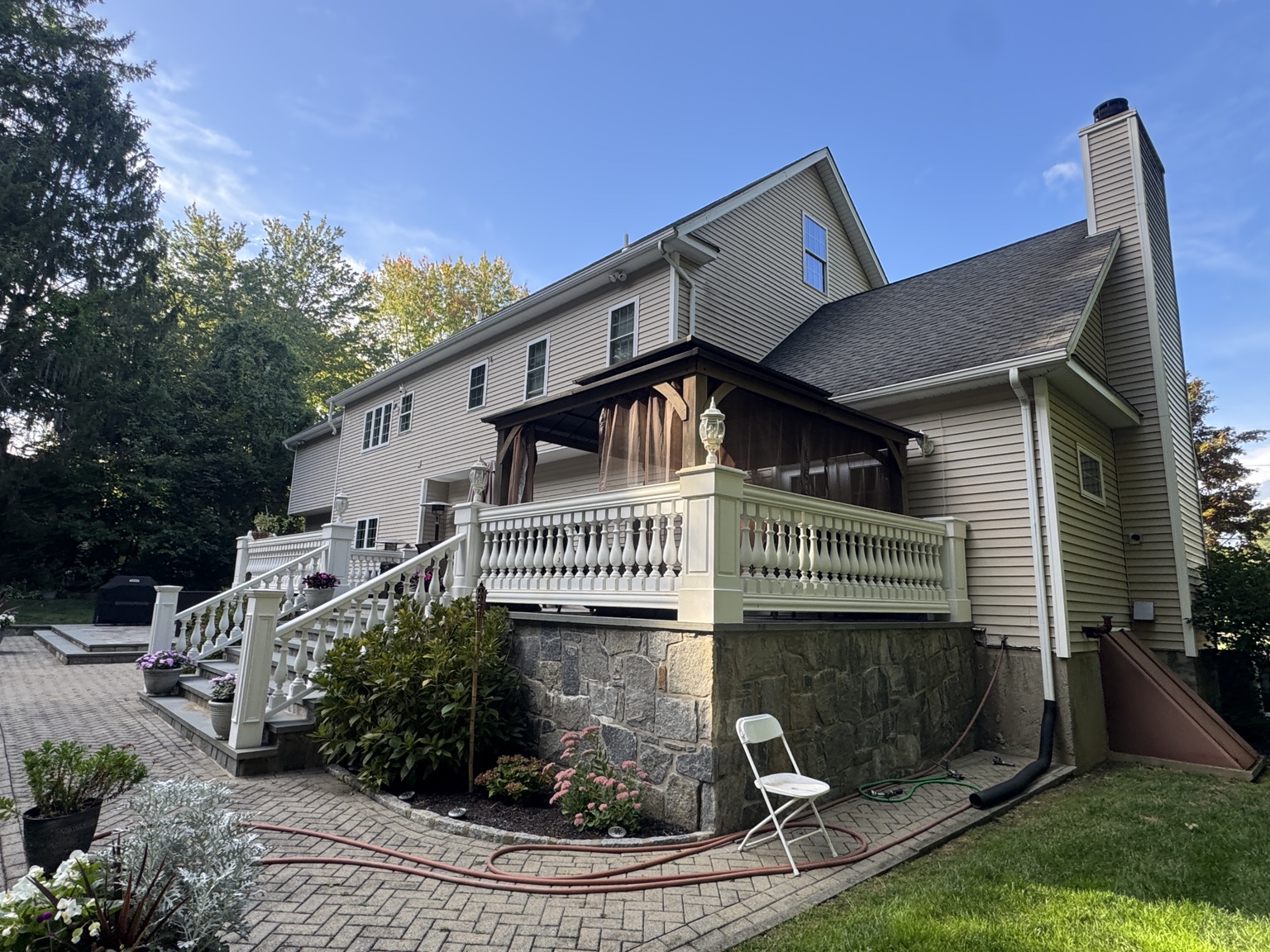 Gutters and a downspout beside a raised deck